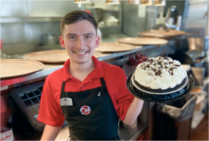 dot coffee shop employee with cake